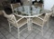 Round top painted aluminum table with four chairs