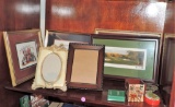 Lot of picture frames and cross-stitching