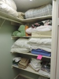 Lot of sheets and blankets and comforters