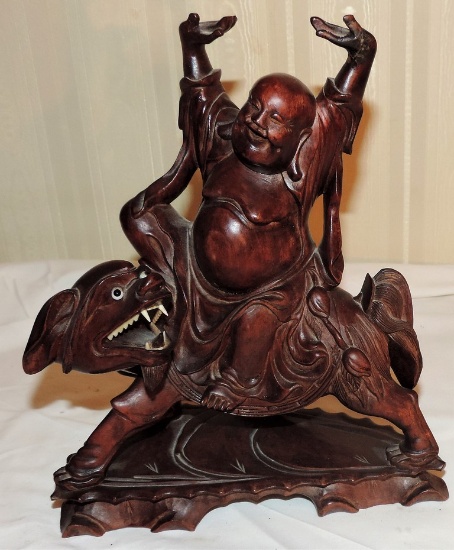 Carved Wooden Buddha on a Animal