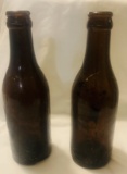 Two Early Brown Glass Coca Cola Bottles