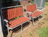 Two Aluminum and Red Wood Folding Chairs