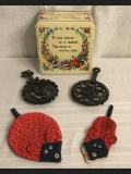 Cast Iron Trivets and Vintage Tin