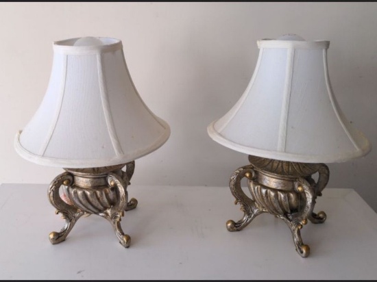 Two silver metal lamps