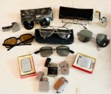 Lot of Eye Glasses and Cigarette Lighters
