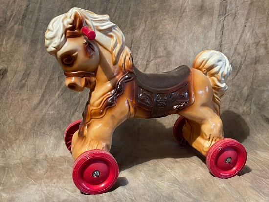 Vintage Plastic Wonder Ride On Horse Toy With Plastic Wheels