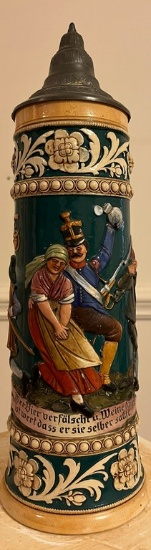 German Beer Stein with Colorful Characters Painted on it