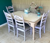 Dining Table with Four Solid Bottom Chairs with Cushions