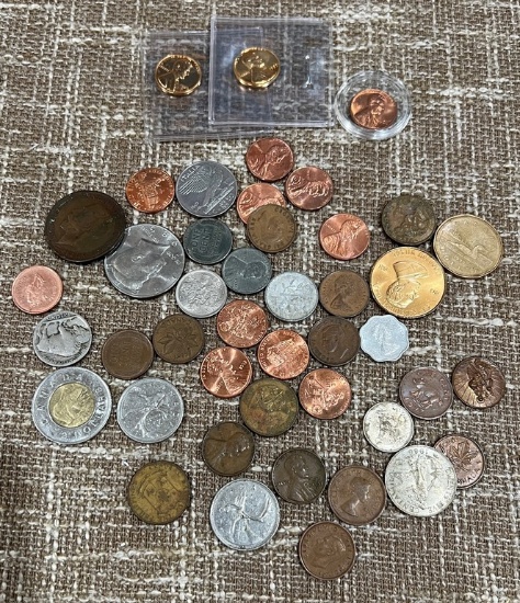 Group Of Foreign Coins and Pennies In An Antique Sail Fish Box