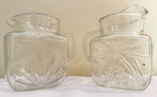 Two Pressed Glass Juice Pitchers
