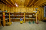 Contents of L-Shaped Shelves, Saw Blades, Grease Guns, Jacks, Riveter and Tools