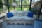 Wicker Couch With Decorative Throw Pillows