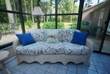 Wicker Couch With Decorative Throw Pillows