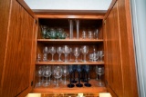 Cabinet of Various Glassware, Wine Glasses, Crystal Serving Platters and Misc on First two Shelves,