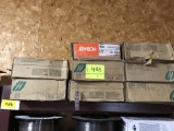 shelf of mig welder wire spools, 8pc