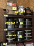 shelf of mig welder wire spools, 9pc