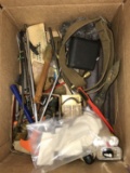 box of of assorted gun parts and cleaning supplies