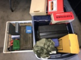 assorted cases and boxes for guns and ammo