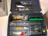 tackle box of topwater jigs, artificail rubber grubs, tc