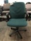 rolling office chair; green fabric
