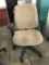 rolling office chair; tan fabric