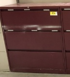 metal 3-drawer lateral file cabinet; red; measures 36