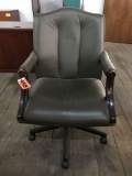 rolling arm chair; dark gray leather with wood