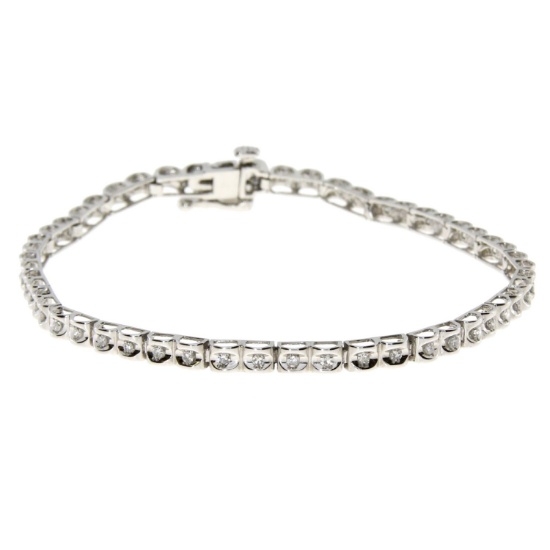 0.50ct Diamond 7'' tennis bracelet in 10kt White Gold. Diamonds are H-I color, round, I1-I3 clarity.