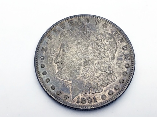 1891-S Morgan silver dollar. Due to increased fraud activity, any coin/jewelry purchase totaling ove