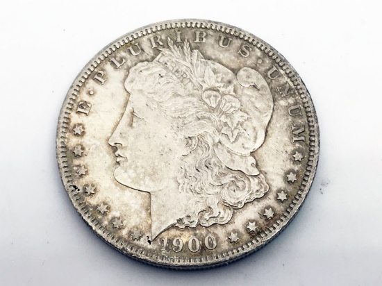 1900-O Morgan silver dollar. Due to increased fraud activity, any coin/jewelry purchase totaling ove