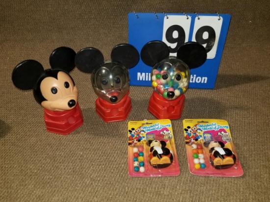 Three Mickey Mouse gumball dispensers and two Mickey Gumball pocket packs