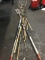 Pile of assorted fishing poles and paddles