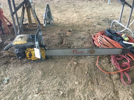Old McCulloch long bar chain saw