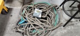Pile of Hose, 2 Tripod Sprinklers and 1 Timer
