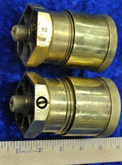 Powell matched pair early cast grease cups.