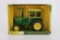 1/16 Ertl Dealer Edition John Deere 4320 with Front Wheel Assist.