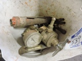 Bucket of gauges, regulators, and parts for torches