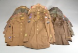LARGE GROUP OF MOSTLY WWII UNIFORMS.