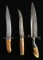 2 LARGE ALL METAL GRIPPED 19TH CENTURY DAGGERS.