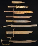 8 EXCAVATED KNIVES, SWORDS & PARTS.