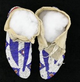 FINE PAIR OF FULLY BEADED TALL SIOUX MOCCASINS.