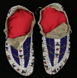 FINE PAIR OF FULLY BEADED PLAINS INDIAN MOCCASINS.