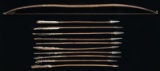 NATIVE AMERICAN BOW AND NINE IRON TIPPED ARROWS.