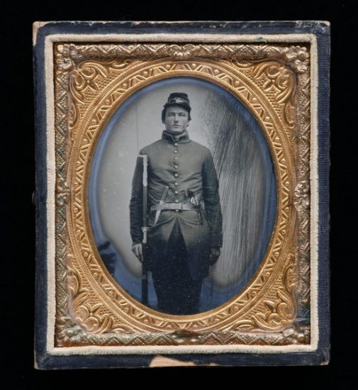 CIVIL WAR AMBROTYPE OF TRIPLE ARMED SOLDIER.
