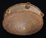 MID-19th CENTURY WOVEN WICKER OR GRASS CANTEEN.
