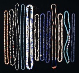 12 NATIVE AMERICAN TRADE BEAD NECKLACES FROM THE