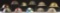 11 US M1917 HELMETS PAINTED WITH UNIT INSIGNIA OR