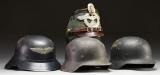 4 WWII GERMAN HELMETS.