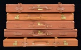 LOT OF 5 MISCELLANEOUS LEATHER SHOTGUN CASES.