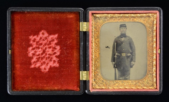TINTYPE OF A STANDING CIVIL WAR ENLISTED SOLDIER.